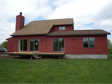 Exterior Back. The two sliding glass doors on the 