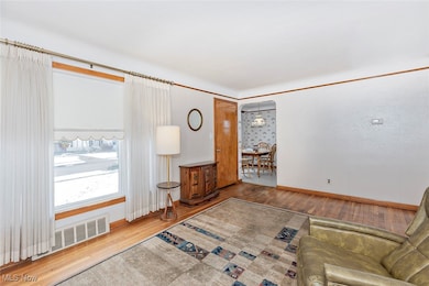 Living room featuring wood finished floors