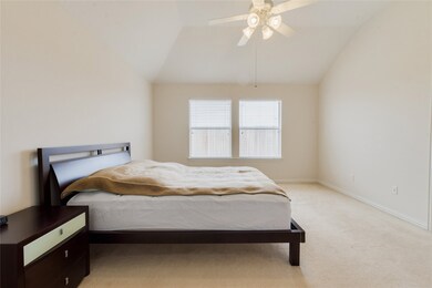 The primary bedroom is situated at the rear of the home in a split floorplan. The walk in closet is huge!
