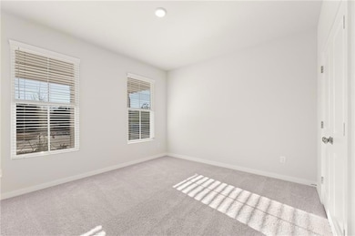 Empty room featuring recessed lighting, baseboards