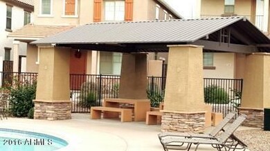 Community pool picnic area across the st