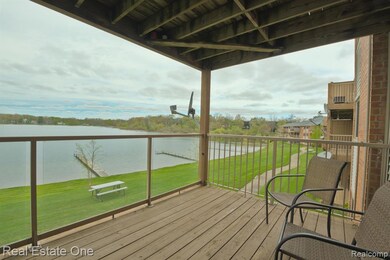 Deck off Family Room with view of lake