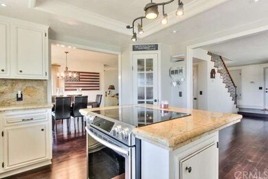 Kitchen looks out into the dining room and family 
