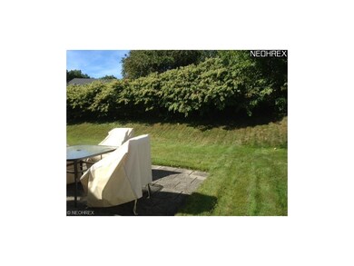 The slight rise and row of bushes in back afford a