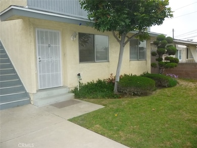 Unit D is located downstairs at the front of the right side building.