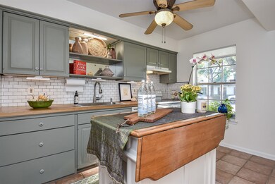 Beautiful sun-filled kitchen with a moveable islan