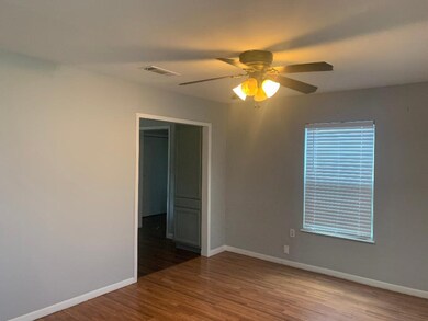 Spare room with light wood-type flooring and a ceiling fan