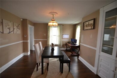 Dining Room features high baseboards and chair rai