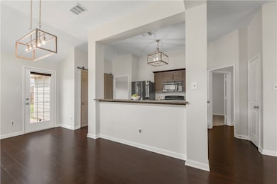 Kitchen featuring black microwave, freestanding re