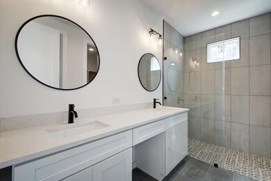 Bathroom featuring a shower stall, tile patterned