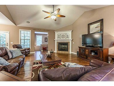 Living Room. Has very nice fireplace with a large opening, which makes it easy to appreciate the gas log flames.