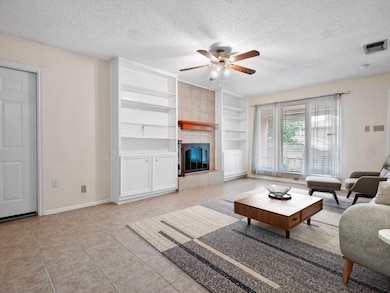 Living room featuring a textured ceiling, ceiling