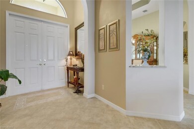 Foyer with light tile patterned floors