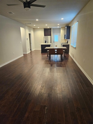 Recreation room featuring recessed lighting, dark wood-style flooring, and ceiling fan