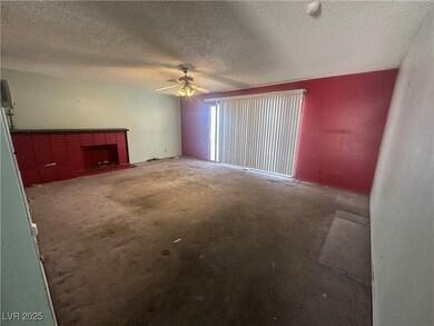 Unfurnished living room featuring a fireplace, a t