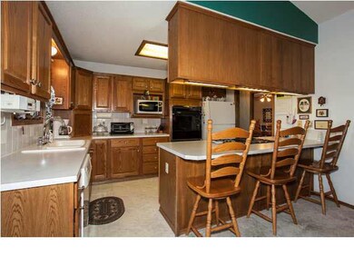 Kitchen includes eating bar