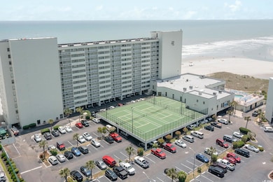 Bird's eye view of a nearby body of water and apartment complex