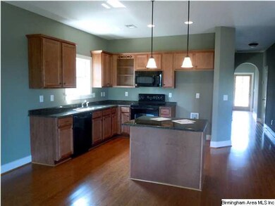 Beautifulkitchen with lots of cabinets.