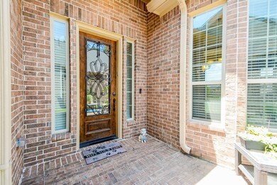 Handsome solid wood door with metal scroll details.