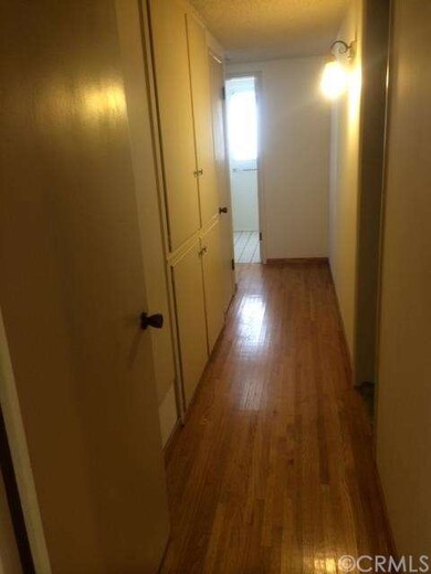 Hallway with built in cabinets.