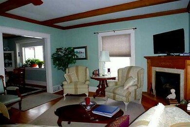 Living Room. Amazing woodwork and hardwood floorin