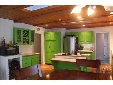 Kitchen. Skylights add to the cheery...