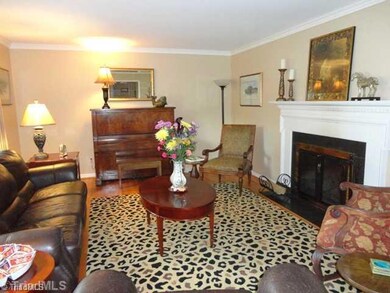 Living Room. Large living room with hardwood floors,and wood burning fireplace
