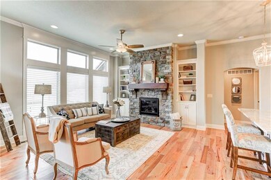 Great room with fireplace. Photos are of another m