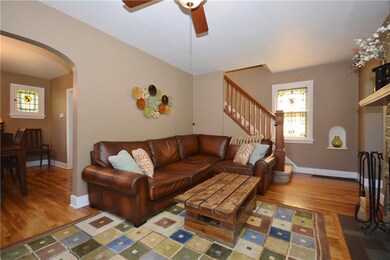 Warm and cozy living room with gleaming Hardwood F
