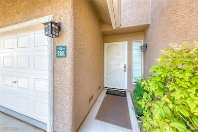 Property entrance featuring stucco siding
