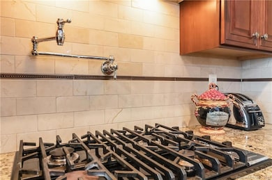 You didn't know you needed a pot filler, until you used one! This custom kitchen is sure to please...