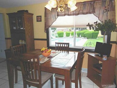 Kitchen Dining. Overlooks pool in back yard.