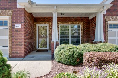 Take a stroll up the front walk to the covered porch.