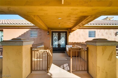 Entrance to property featuring a gate, stucco sidi