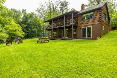 Rear view showing the backyard and the expansive d