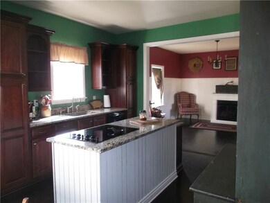 Island with cooktop and granite