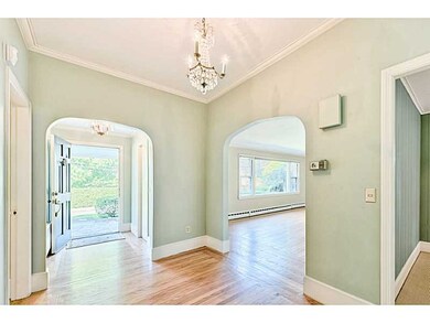 Entry. Entry hall with coat closet and foyer. Arch