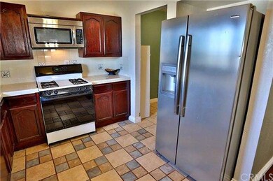 Kitchen with separate laundry room/storage area 