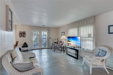 Living room featuring sub flooring and french door