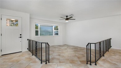 Foyer featuring ceiling fan and baseboards