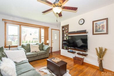 LIVING ROOM FACING FRONT DOOR.