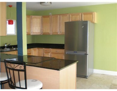 Kitchen. Right of refrigerator is room for a table