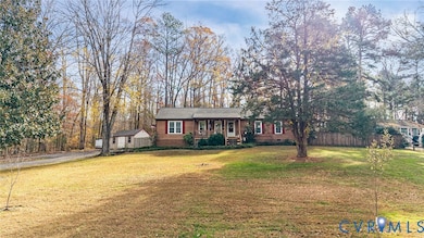 Ranch-style house featuring covered porch, crawl space, and an outdoor structure