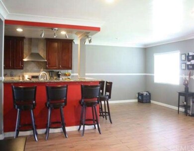 Kitchen bar and spacious eating area. 