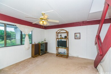 A ceiling fan to move the trade winds throughout t