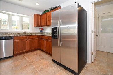 Tile floor in kitchen with granite and stainless s