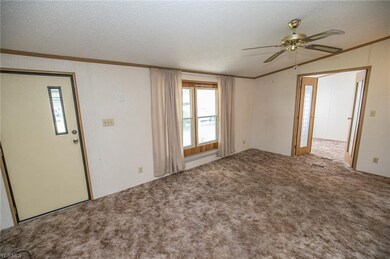 Living room adjacent to den/office