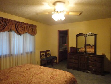 View of master bedroom and door to master bathroom