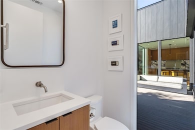 Bathroom with vanity and toilet