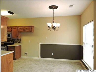 Eat in area in kitchen with chair rail and two ton